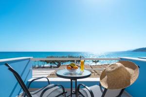 a table with a bowl of fruit on a balcony at BOGGI in Goúdhouros