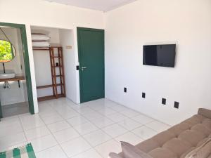 TV a/nebo společenská místnost v ubytování Pousada Makani Kai