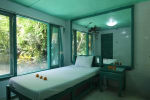 Voodi või voodid majutusasutuse Belvilla 93915 Bamboo Villa Near Central Ubud toas