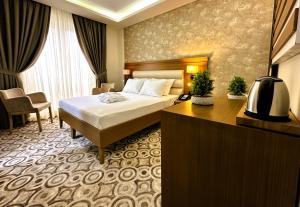 Cama ou camas em um quarto em AQUA MARINN HOTEL SPA / WELLNESS