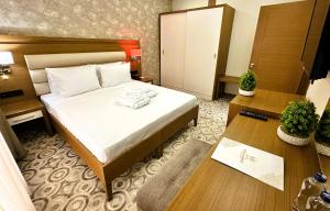 מיטה או מיטות בחדר ב-AQUA MARINN HOTEL SPA / WELLNESS