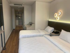 Postel nebo postele na pokoji v ubytování Theodosius Hotel