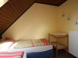 Postel nebo postele na pokoji v ubytování Holiday Apartment Hoddersdiek, Burhave