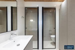 a bathroom with a sink and a toilet at C44 Ultimate Luxury Waterfront Penthouse in Hanko +10 photos
