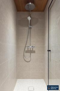 a bathroom with a shower with a glass door at C44 Ultimate Luxury Waterfront Penthouse in Hanko