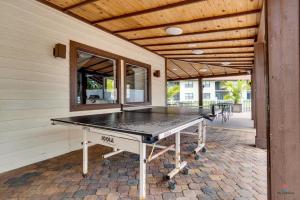 a ping pong table sitting on a patio at MyCataleya Beautiful Florida Condo (Bradenton) in Bradenton