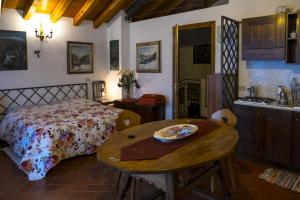 A bed or beds in a room at La Residence da Caterina