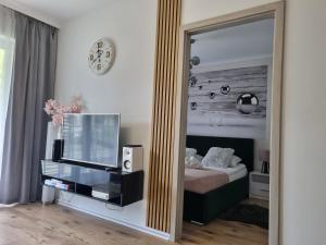 Televízia a/alebo spoločenská miestnosť v ubytovaní LAGUNA Apartament Polanica Residence 27 -SPA-