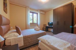 Postel nebo postele na pokoji v ubytování Agriturismo Rascioni & Cecconello
