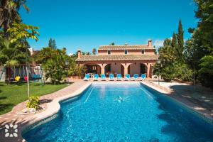 a swimming pool in front of a villa at Villa Benimarco by Abahana Villas in Benissa