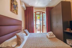 Postel nebo postele na pokoji v ubytování Agriturismo Rascioni & Cecconello
