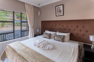 Giường trong phòng chung tại Villa Africa Boutique Hotel & Spa +36 ảnh