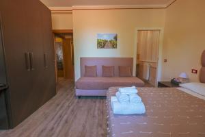 Postel nebo postele na pokoji v ubytování Agriturismo Rascioni & Cecconello