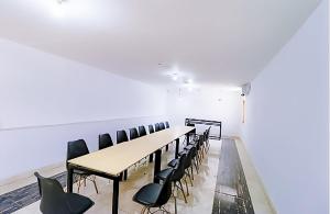a conference room with a long table and chairs at Hotel Royal - Near Max Hospital IP Extension in New Delhi
