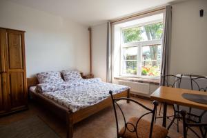 Postel nebo postele na pokoji v ubytování Hornický penzion + 37 fotografií