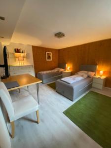 Apartment Reininghaus - Low budget tesisinde bir odada yatak veya yataklar