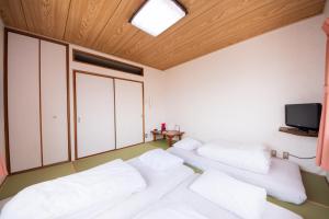 Postel nebo postele na pokoji v ubytování Yamato Saidaiji Hotel SINDAI