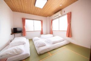 Postel nebo postele na pokoji v ubytování Yamato Saidaiji Hotel SINDAI