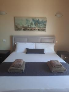 Postelja oz. postelje v sobi nastanitve Avanda Hotel