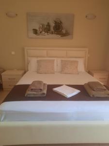 Postel nebo postele na pokoji v ubytování Avanda Rooms + 8 fotografií