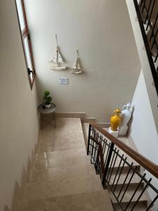 a staircase in a house with white walls at San Pietro Otranto in Otranto