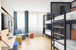Letto o letti in una camera di H2 Hotel Wien Schönbrunn