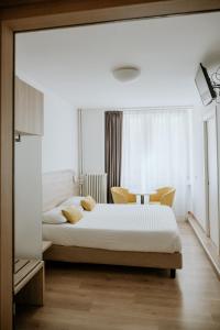 Een bed of bedden in een kamer bij Hotel Venezia