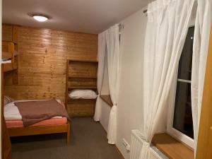 Postel nebo postele na pokoji v ubytování Alba Apartmany Železná Ruda