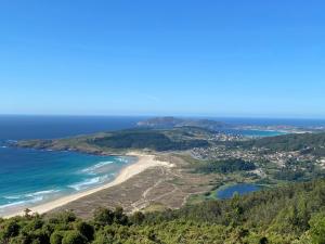 an aerial view of a beach and the ocean at Doniños74 in Ferrol