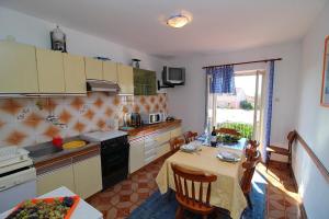 Kuchyň nebo kuchyňský kout v ubytování Apartment Domestic