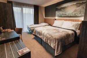Voodi või voodid majutusasutuse Atrium Hotel - Family friendly toas