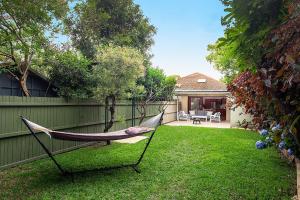 a hammock in the yard of a house at Coogee Rest in Sydney