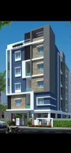 a rendering of a tall building at SREENIVASA HOME STAY in Tirupati