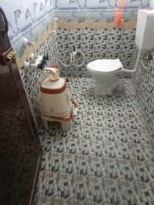 a bathroom with a sink and a toilet at SREENIVASA HOME STAY in Tirupati +53 photos