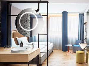 Letto o letti in una camera di H2 Hotel Wien Schönbrunn