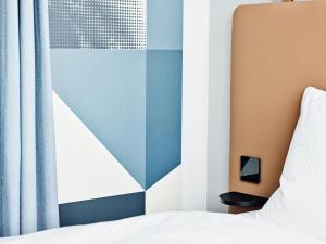 Letto o letti in una camera di H2 Hotel Wien Schönbrunn