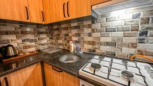 Een keuken of kitchenette bij Mykonut Boutique Suites