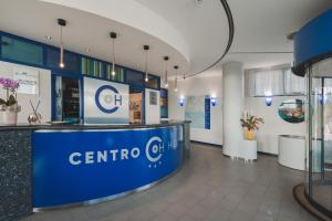 a lobby of a center for ctcc with a counter at CENTRO HOTEL in Marcon