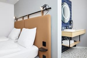 Letto o letti in una camera di H2 Hotel Wien Schönbrunn