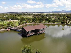 an aerial view of a building in the middle of a lake at Epitome Apartment, Swara Ranch-Nanyuki in Nanyuki