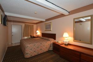 Ένα ή περισσότερα κρεβάτια σε δωμάτιο στο Newcastle Motel +11 φωτογραφίες