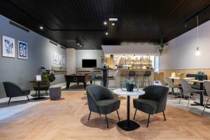 TV a/nebo společenská místnost v ubytování Green Park Hotel Brugge