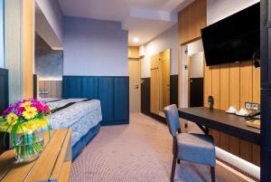 Televízia a/alebo spoločenská miestnosť v ubytovaní Atrium Hotel - Family friendly
