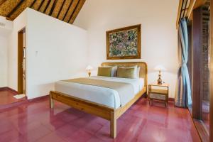 Postel nebo postele na pokoji v ubytování Jati Home Stay