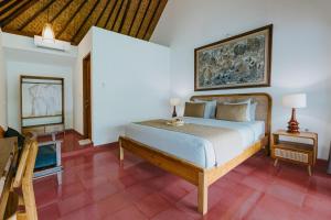 Postel nebo postele na pokoji v ubytování Jati Home Stay