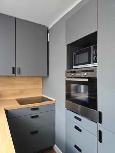 Kuchnia lub aneks kuchenny w obiekcie Apartament Pod Dwójką