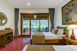 Postel nebo postele na pokoji v ubytování Jati Home Stay