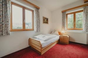 Rúm í herbergi á Hotel Semriacherhof