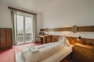 Rúm í herbergi á Hotel Semriacherhof