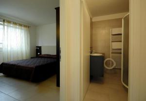 Posteľ alebo postele v izbe v ubytovaní Casa Piccola FeWo